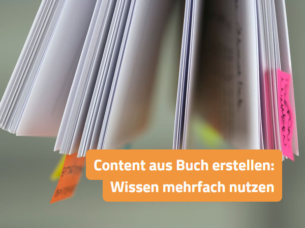 Aufgeschlagenes Buch mit bunten Haftstreifen an markierten Seiten